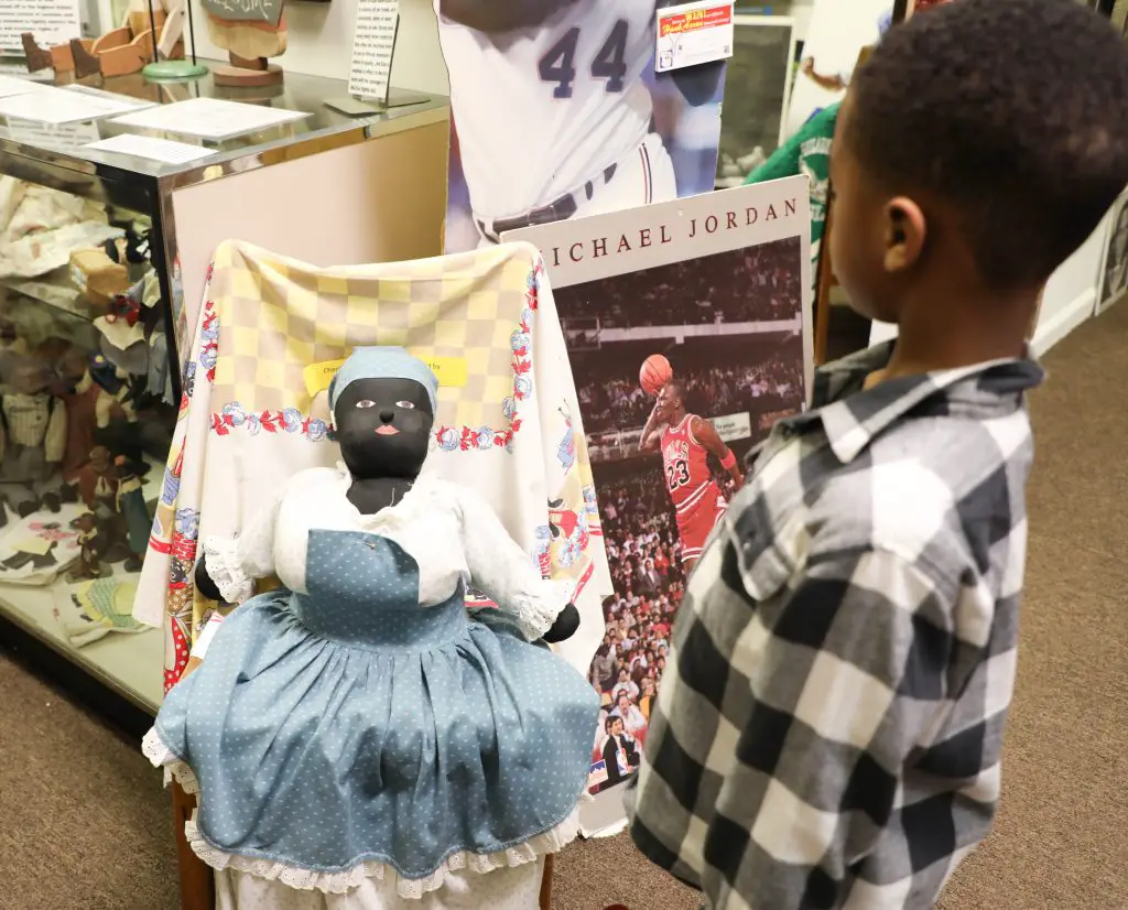 child looking at mammie doll at Black history museum. thins to do in thomasville georgia