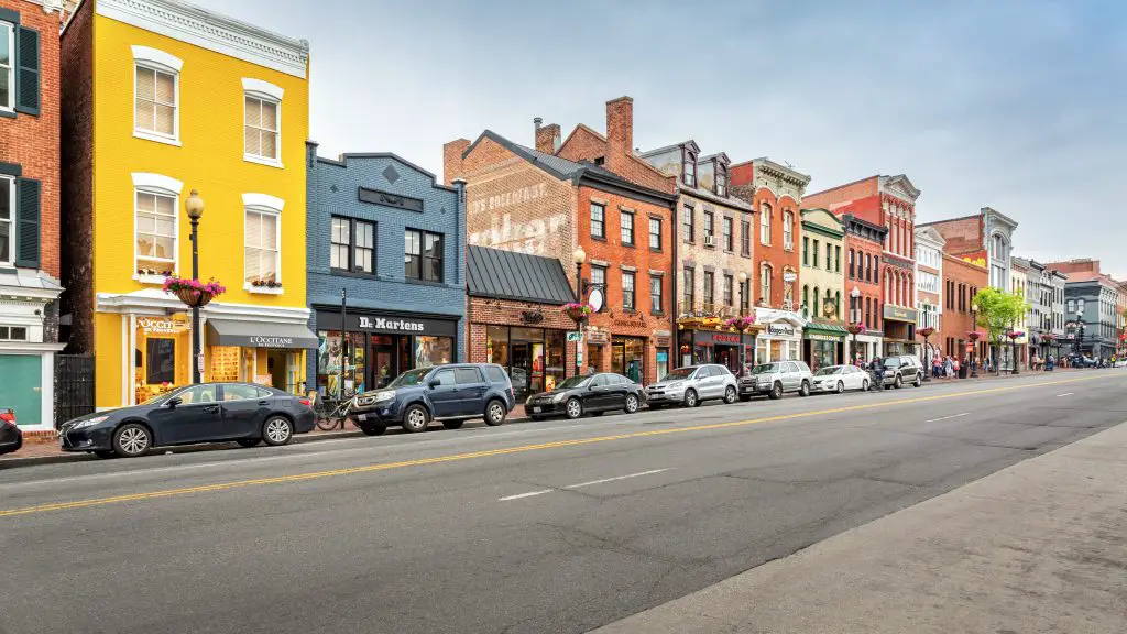 A photo of the multi-colored historical buildings along a street int eh Georgetown neighborhood.