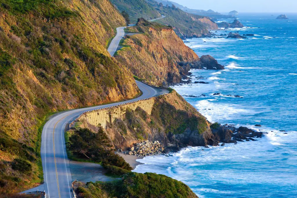 Aerial image of the famed roadway along the California coast with the Pacific Ocean to the right. Best Summer Destinations in the US - Big Sur