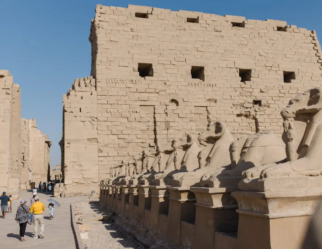 famous image of the line of lions lying down in front of karnak temple