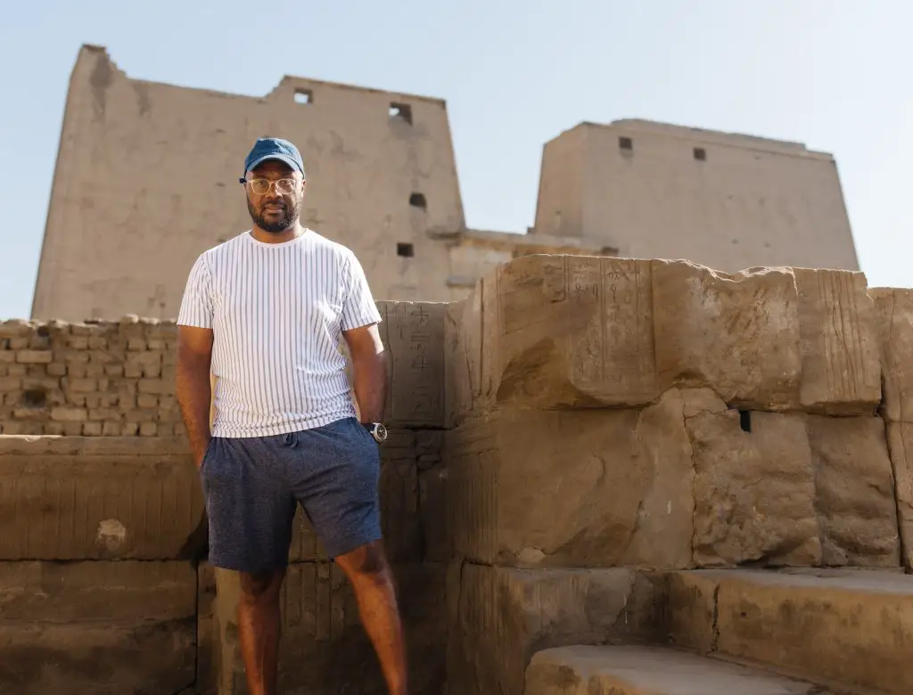 Man in front of the Temple of Horus in Luxor