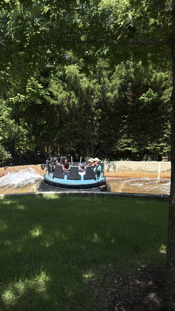 Our family riding the roman rapids water ride